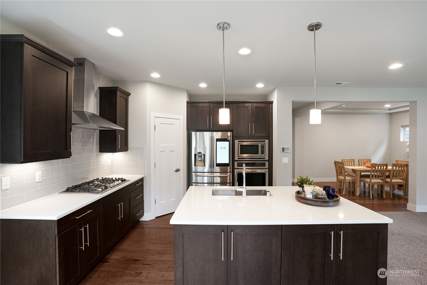 1218 198th Place Southeast Bothell, WA 98012 - Photo 11 of 38 a kitchen with kitchen island a counter top space a sink stainless steel appliances and cabinets