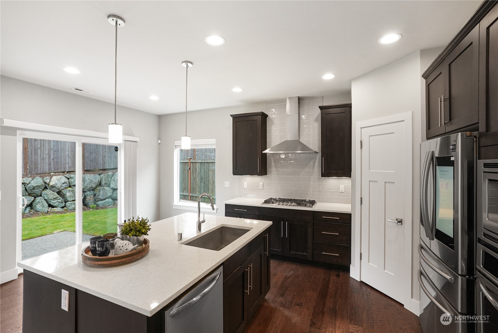 1218 198th Place Southeast Bothell, WA 98012 - Photo 10 of 38 a kitchen with sink cabinets and refrigerator