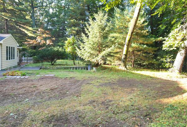 10 Highgate Road Wayland, MA 01778 - Photo 23 of 29 a view of outdoor space with trees all around