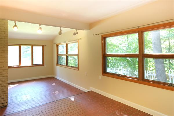 10 Highgate Road Wayland, MA 01778 - Photo 4 of 29 a view of an empty room with a window and wooden floor