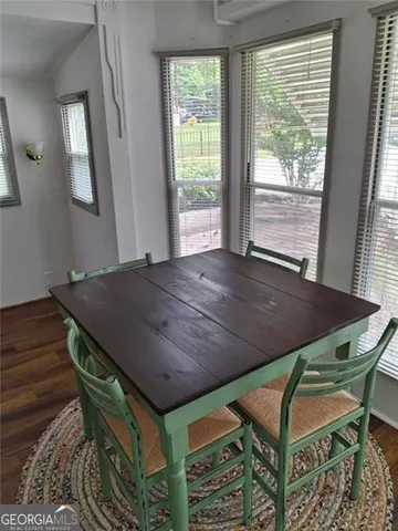 a dining room with a table and chairs