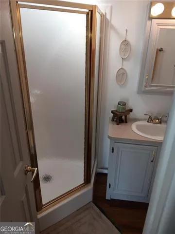 a view of kitchen with cabinets and wooden floor