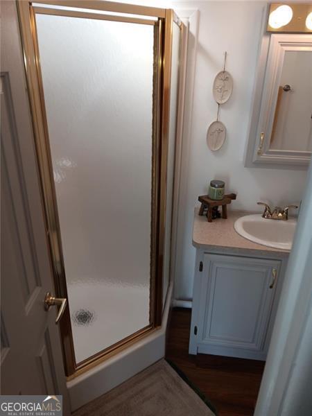 4 Fleetwood Road, Unit 502 Cleveland, GA 30528 - Photo 33 of 45 a bathroom with a sink a mirror and shower