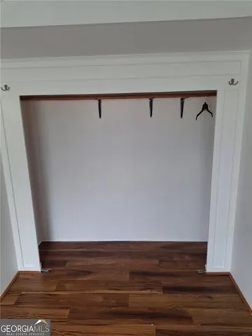 a bedroom with a bed and closet