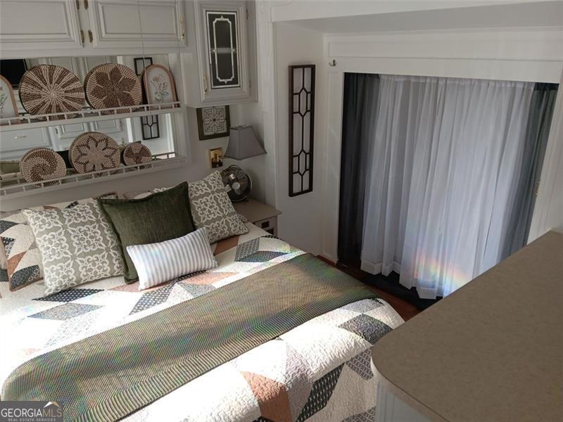 4 Fleetwood Road, Unit 502 Cleveland, GA 30528 - Photo 38 of 45 a bedroom with a bed and closet