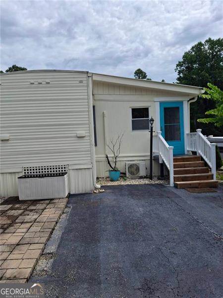 4 Fleetwood Road, Unit 502 Cleveland, GA 30528 - Photo 42 of 45 a front view of a house with garage