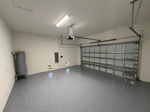 a bathroom with a granite countertop toilet and a sink