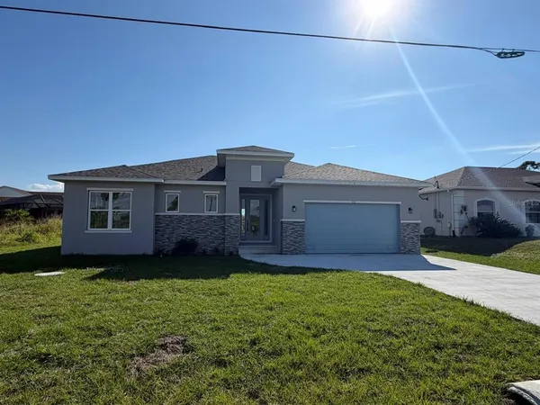 front view of a house with a yard