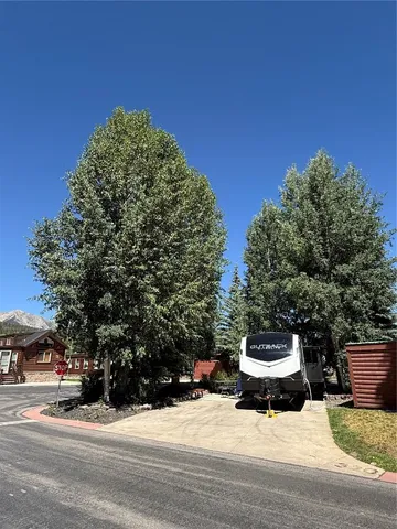a roof deck with a table and chairs