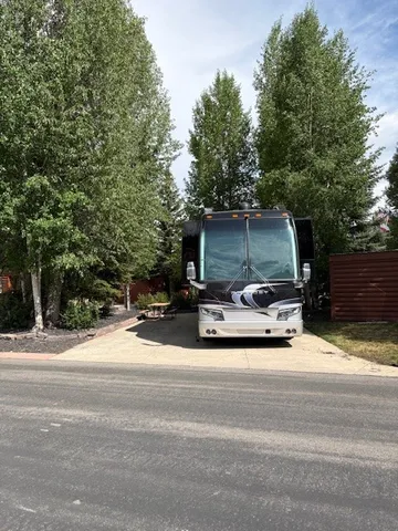 a view of a patio with a table and chairs a couches and a small yard
