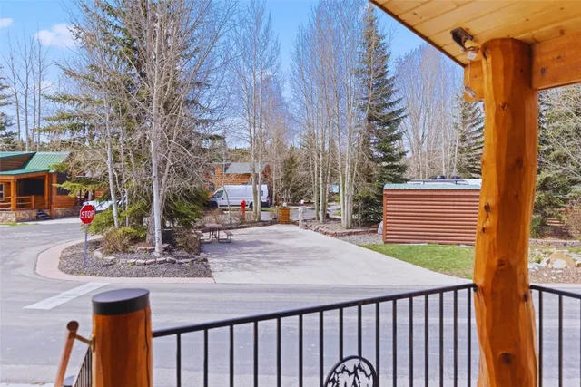 a view of a patio with a table and chairs