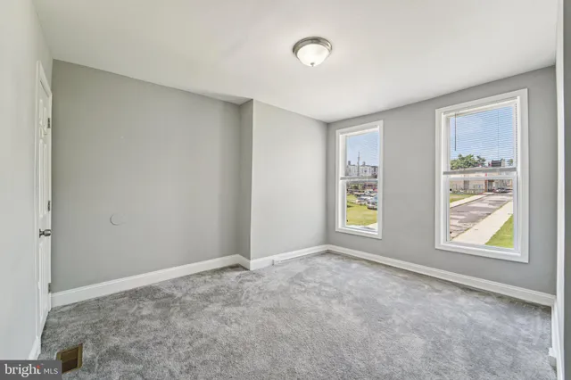 a view of an empty room with a window