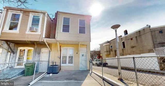 a front view of a house with glass windows