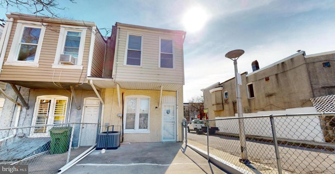 1820 East Lafayette Avenue Baltimore, MD 21213 - Photo 17 of 17 a front view of a house with glass windows