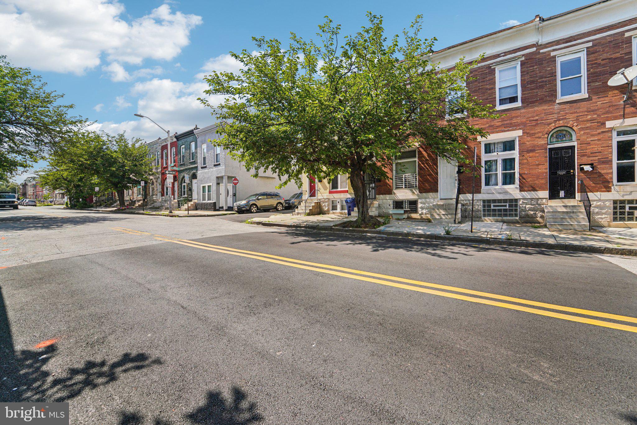 1820 East Lafayette Avenue Baltimore, MD 21213 - Photo 2 of 17 a view of street with large buildings