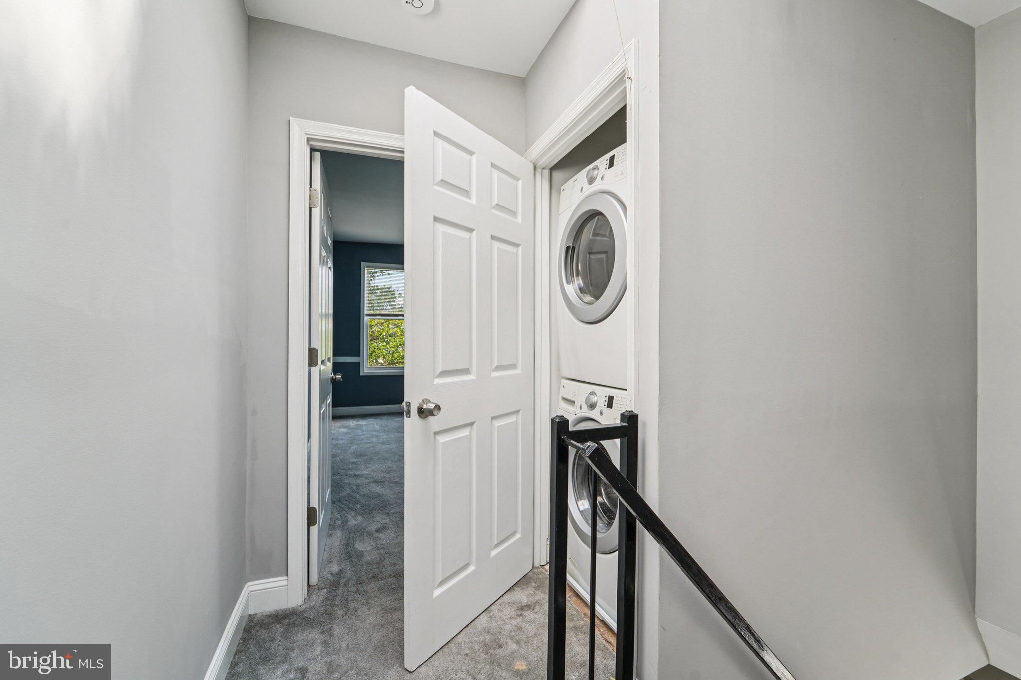 1820 East Lafayette Avenue Baltimore, MD 21213 - Photo 10 of 17 a view of a hallway with washer and dryer