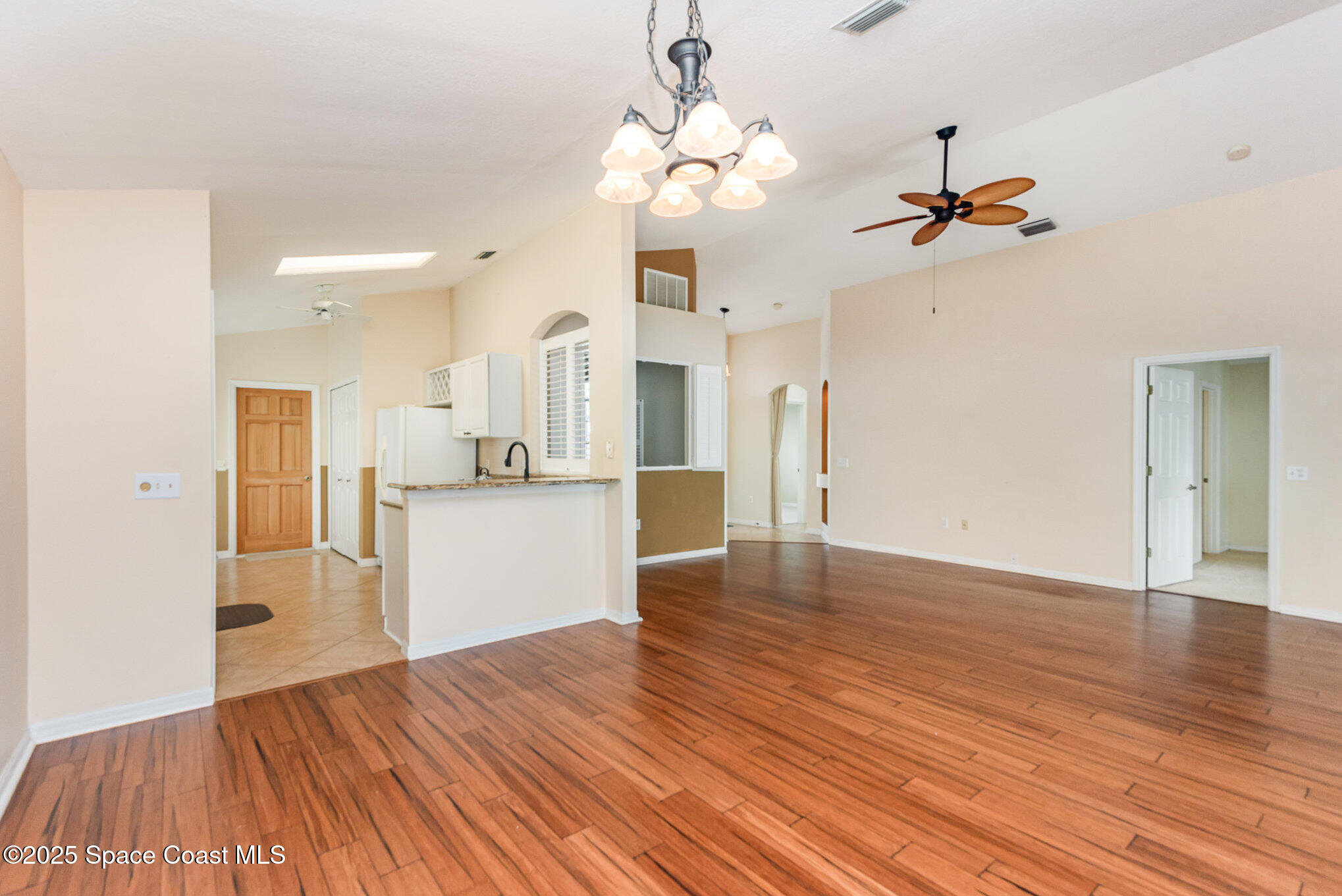 2597 Addington Circle Rockledge, FL 32955 - Photo 8 of 28 a view of a kitchen with wooden floor and a sink