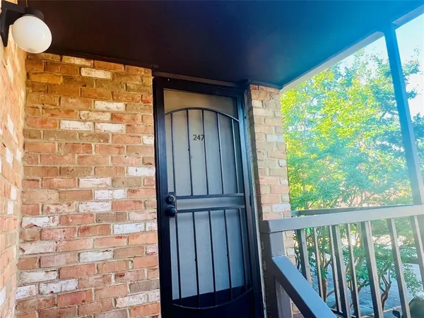 a view of balcony with wooden floor