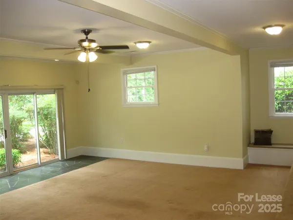 a view of an empty room with a window