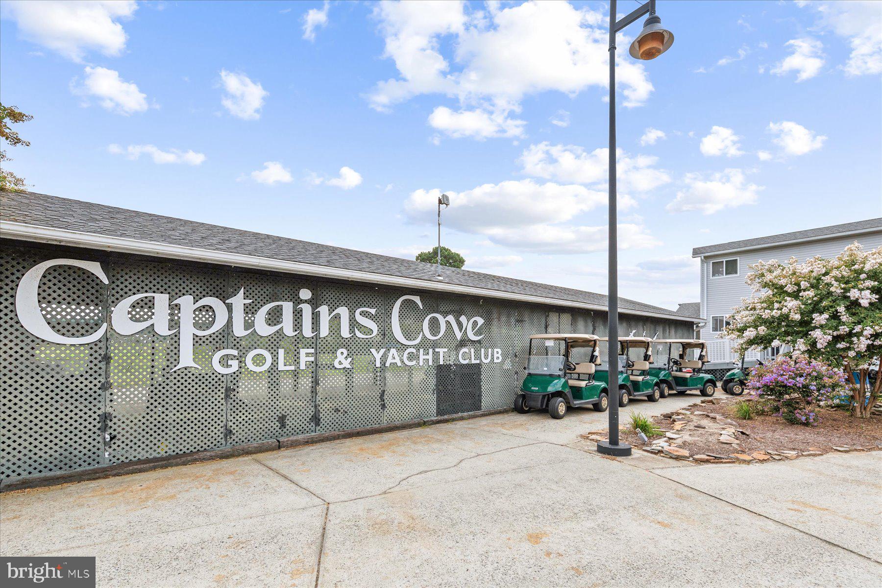 3336 Blackbeard Road Greenbackville, VA 23356 - Photo 47 of 51 a front view of a building with garage