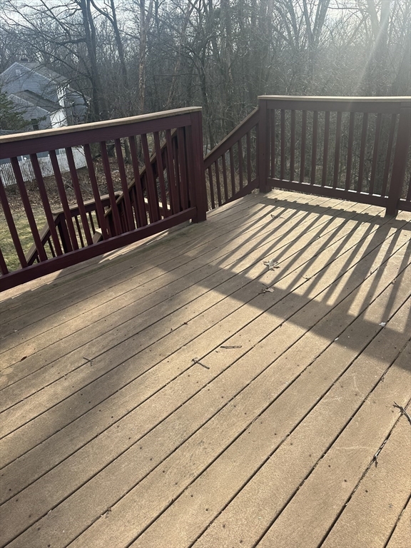 56 Howe Avenue, Unit 1 Shrewsbury, MA 01545 - Photo 9 of 10 a wooden bench sitting on top of a wooden floor