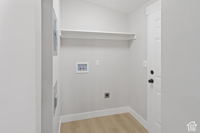 96 Barrington Way Layton, UT 84041 - Photo 15 of 18 Laundry area featuring light wood-finish flooring, a white utility shelf, and laundry hookups