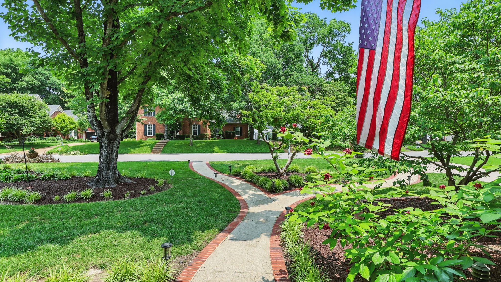 1719 Waterford Road Murfreesboro, TN 37129 - Photo 16 of 55 a front view of a house with a yard and potted plants