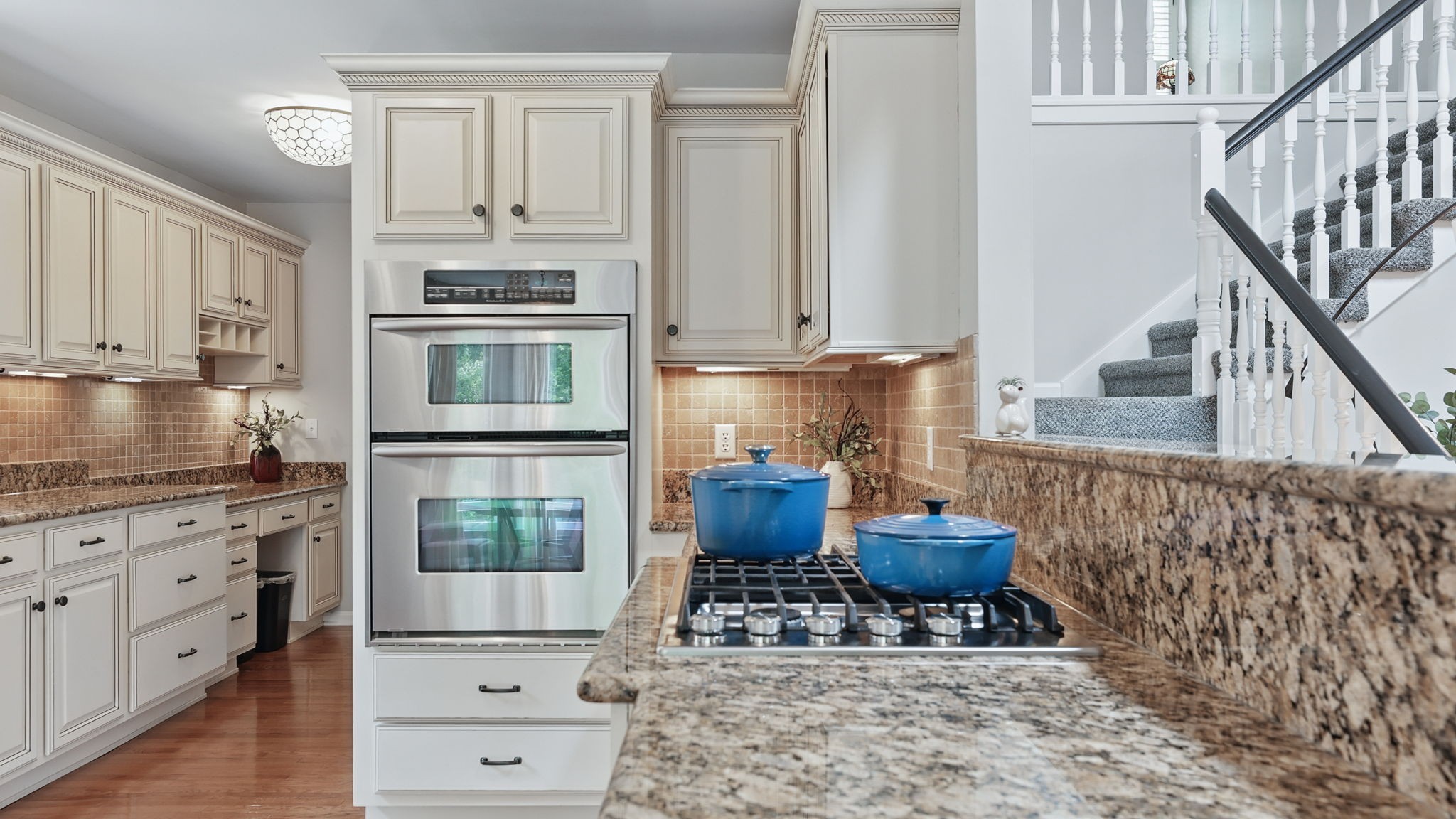 1719 Waterford Road Murfreesboro, TN 37129 - Photo 23 of 55 a kitchen with stainless steel appliances a stove a sink and cabinets