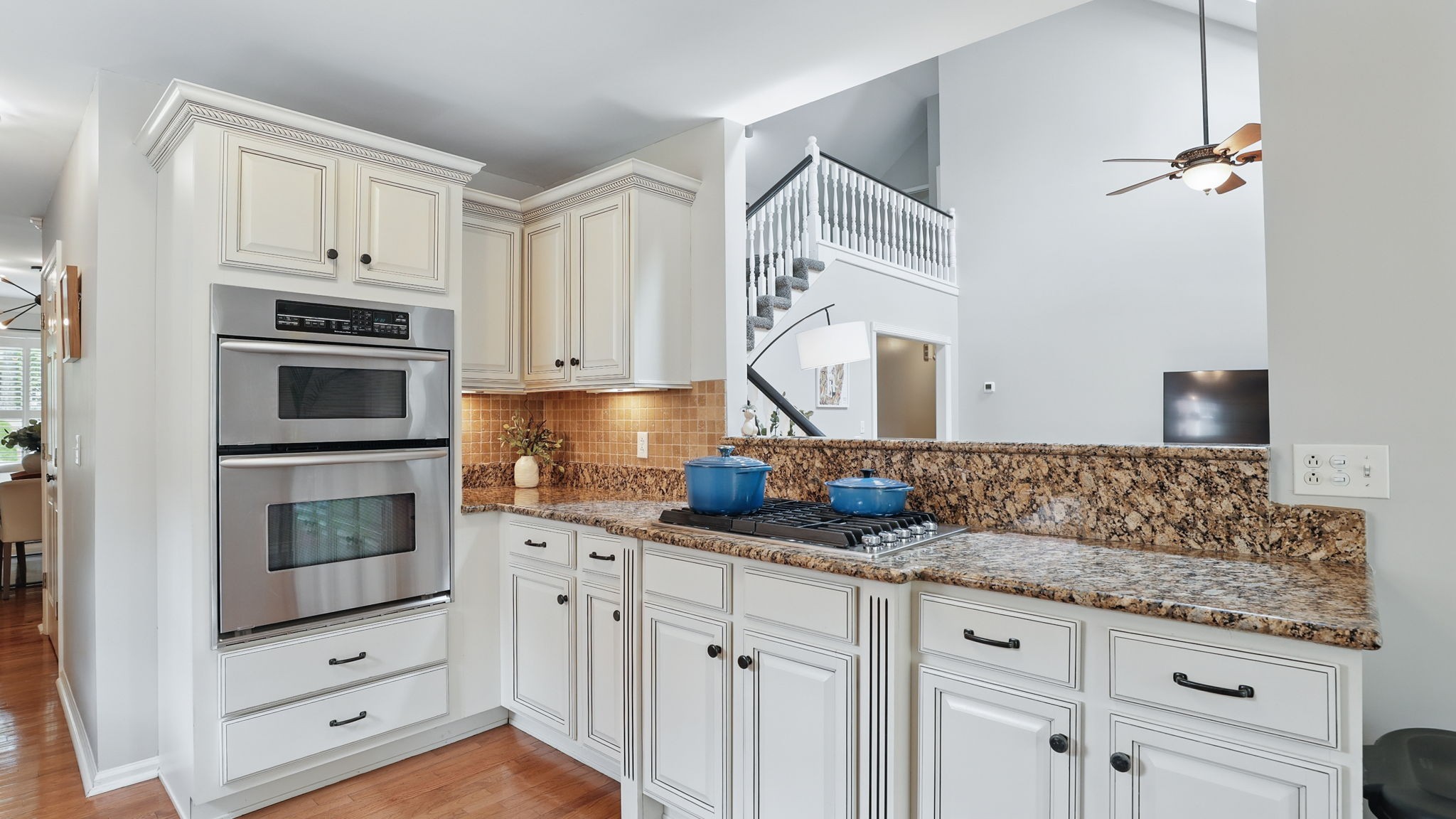 1719 Waterford Road Murfreesboro, TN 37129 - Photo 27 of 55 a kitchen with granite countertop white cabinets and stainless steel appliances