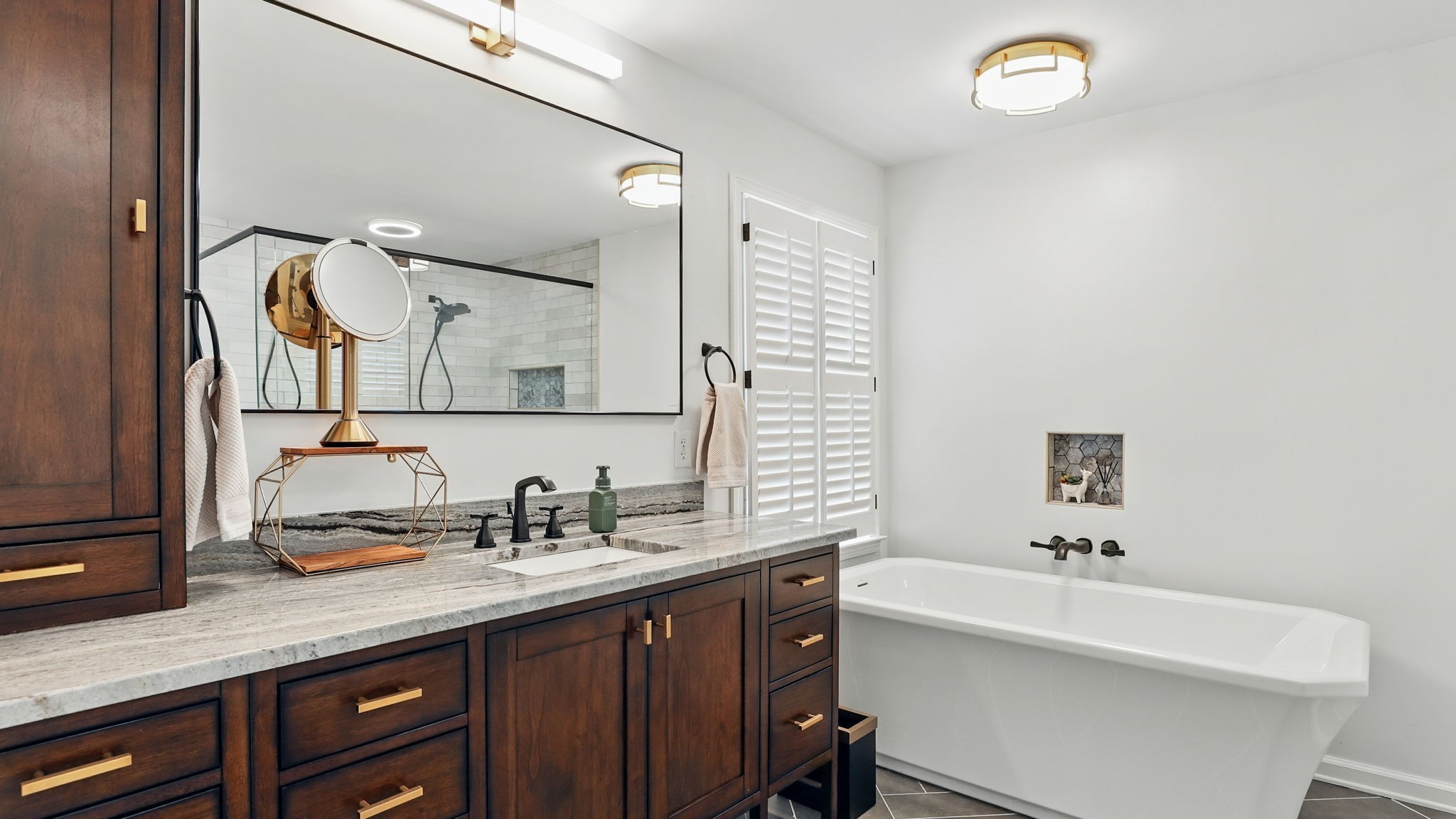 1719 Waterford Road Murfreesboro, TN 37129 - Photo 37 of 55 a bathroom with a sink a large mirror and a bathtub