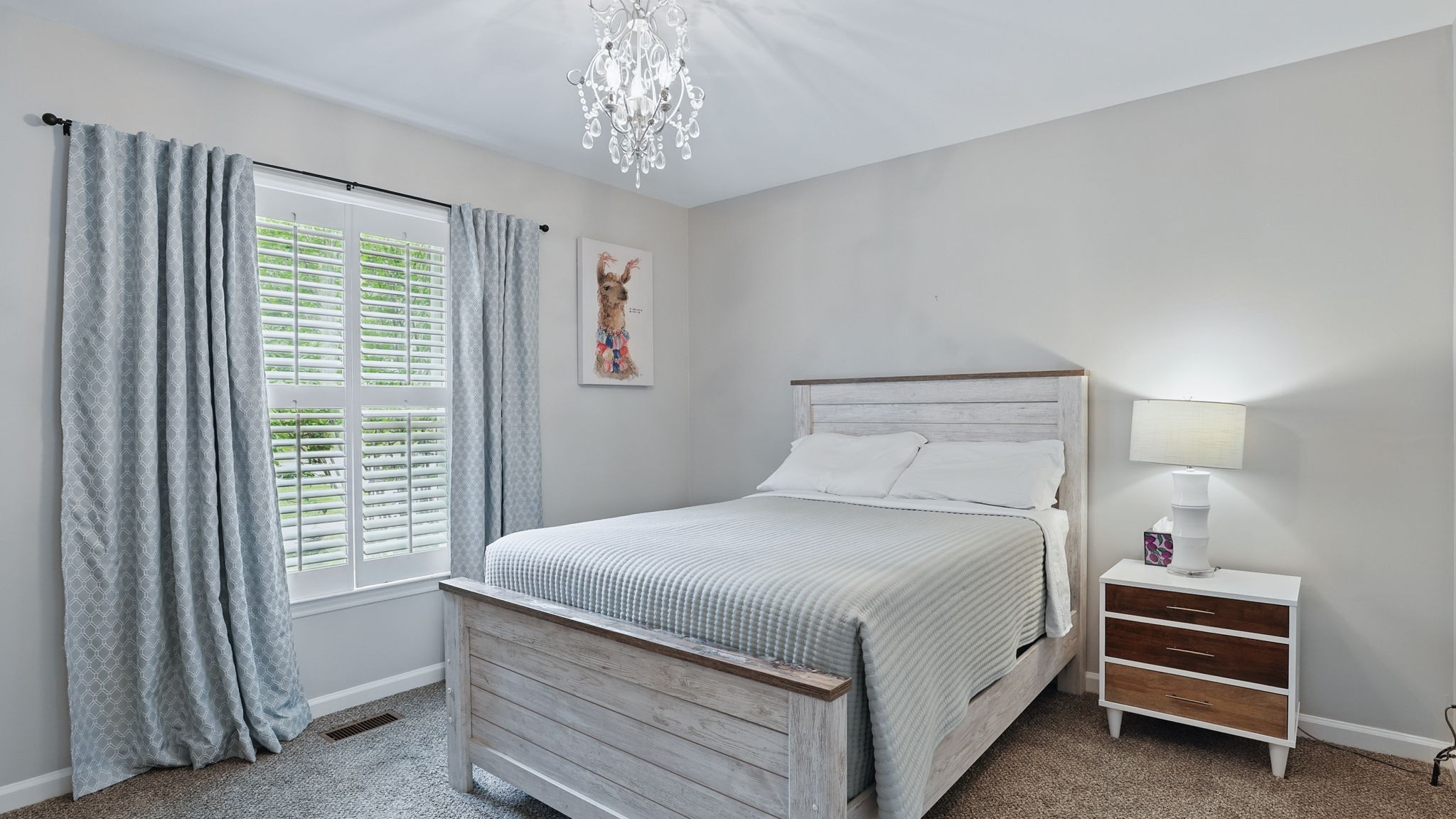 1719 Waterford Road Murfreesboro, TN 37129 - Photo 41 of 55 a bedroom with a bed and a chandelier