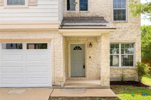 a view of a entryway door front of a house