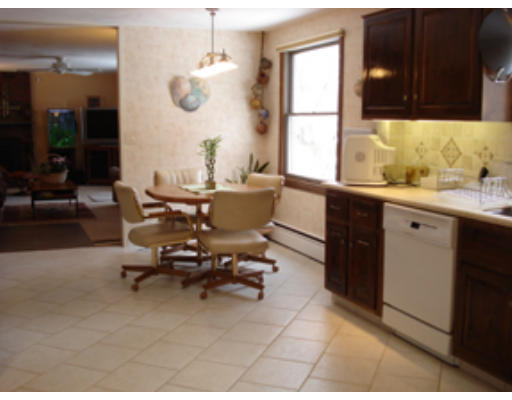 7 Eisenhower Road Marblehead, MA 01945 - Photo 8 of 9 a room with a large window and table