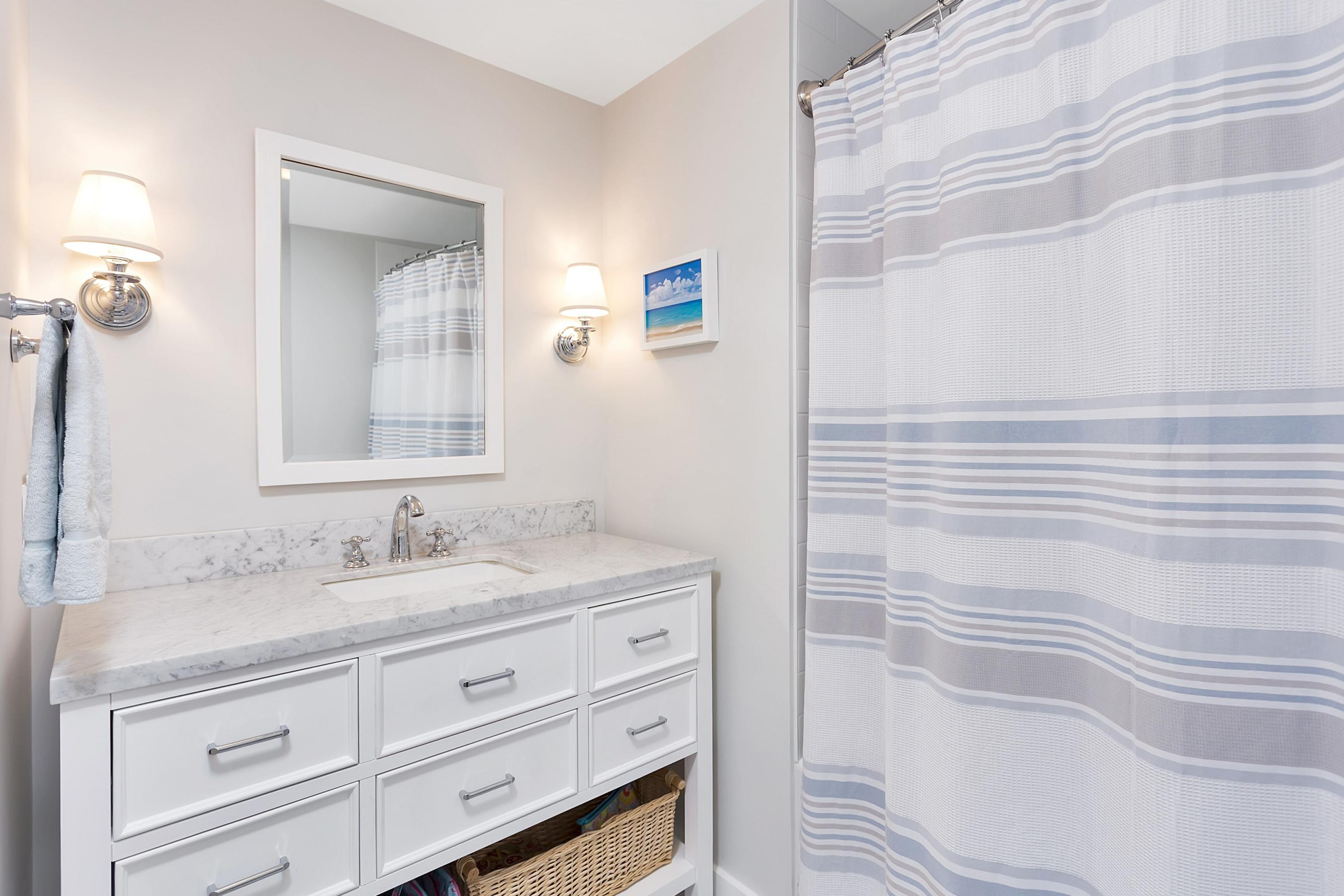 73 Locust Hill Road Darien, CT 06820 - Photo 17 of 34 a bathroom with a sink and a mirror