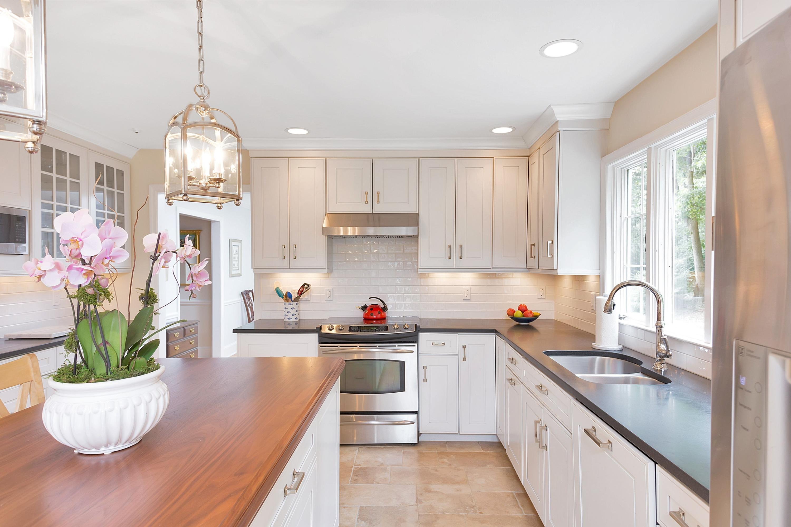 73 Locust Hill Road Darien, CT 06820 - Photo 10 of 34 a kitchen with a stove a sink and cabinets