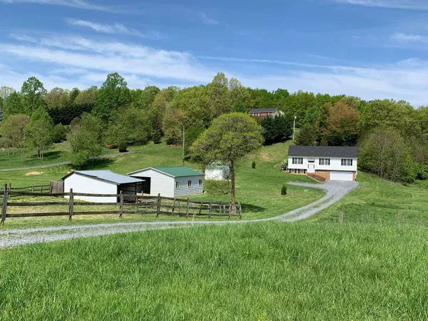 a view of a house with a big yard