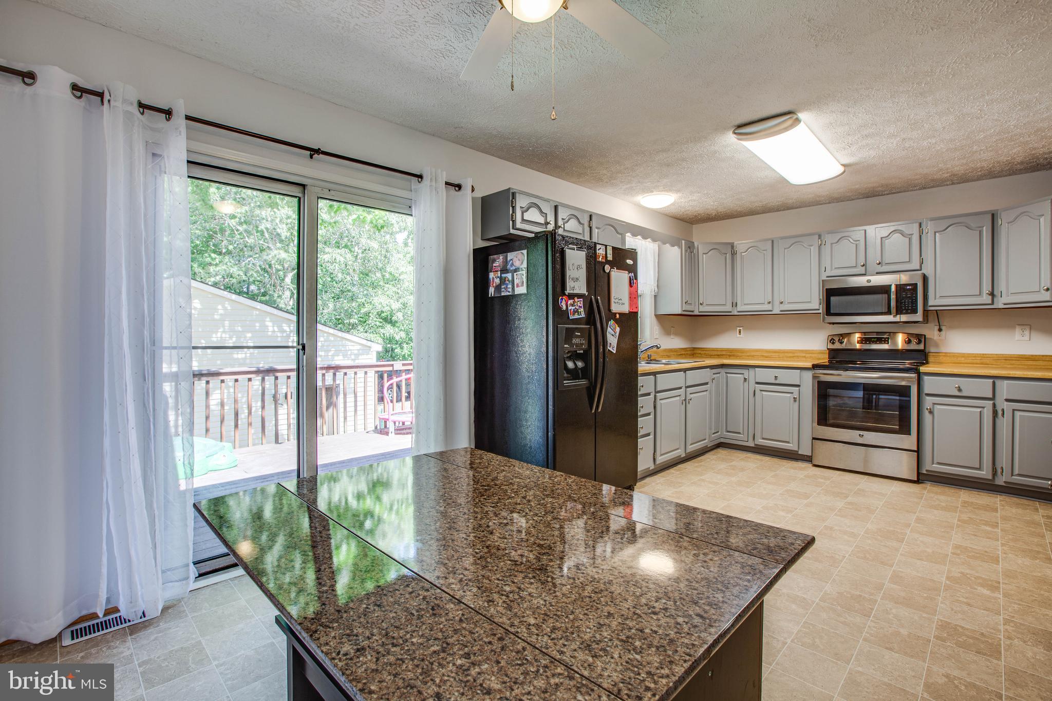 221 Spotswood Road Locust Grove, VA 22508 - Photo 12 of 24 Sliding door to rear deck