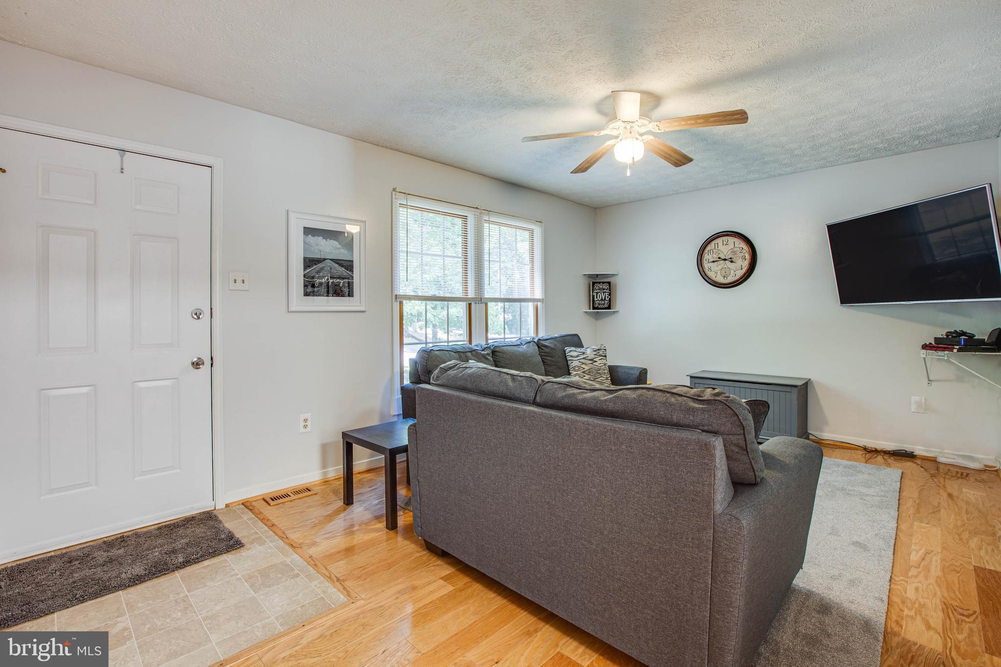 221 Spotswood Road Locust Grove, VA 22508 - Photo 6 of 24 Main level Living Room with Hardwood floors