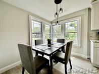 275 Sound Road Greenport, NY 11944 - Photo 17 of 28 Dining space with healthy amount of natural light and light wood-type flooring