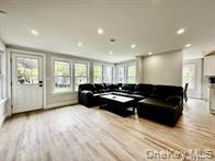 275 Sound Road Greenport, NY 11944 - Photo 18 of 28 Living area with light wood-style flooring, recessed lighting, and plenty of natural light