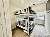 275 Sound Road Greenport, NY 11944 - Photo 22 of 28 Bedroom featuring baseboards and light wood-style flooring