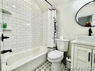 275 Sound Road Greenport, NY 11944 - Photo 25 of 28 Bathroom with shower / bath combo with shower curtain, vanity, and vaulted ceiling