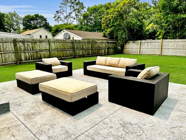 275 Sound Road Greenport, NY 11944 - Photo 9 of 28 Fenced backyard featuring an outdoor living space and a patio area