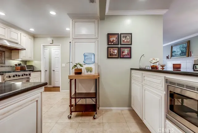 a kitchen with a refrigerator and cabinets