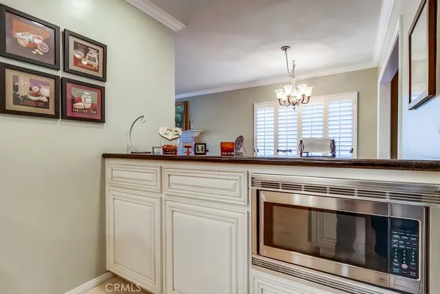 a kitchen with a stove and cabinets