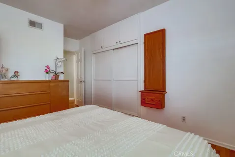 a bedroom with a bed and a cabinets