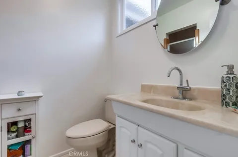 a bathroom with a toilet and a sink