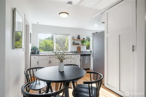 a dining room with furniture and window