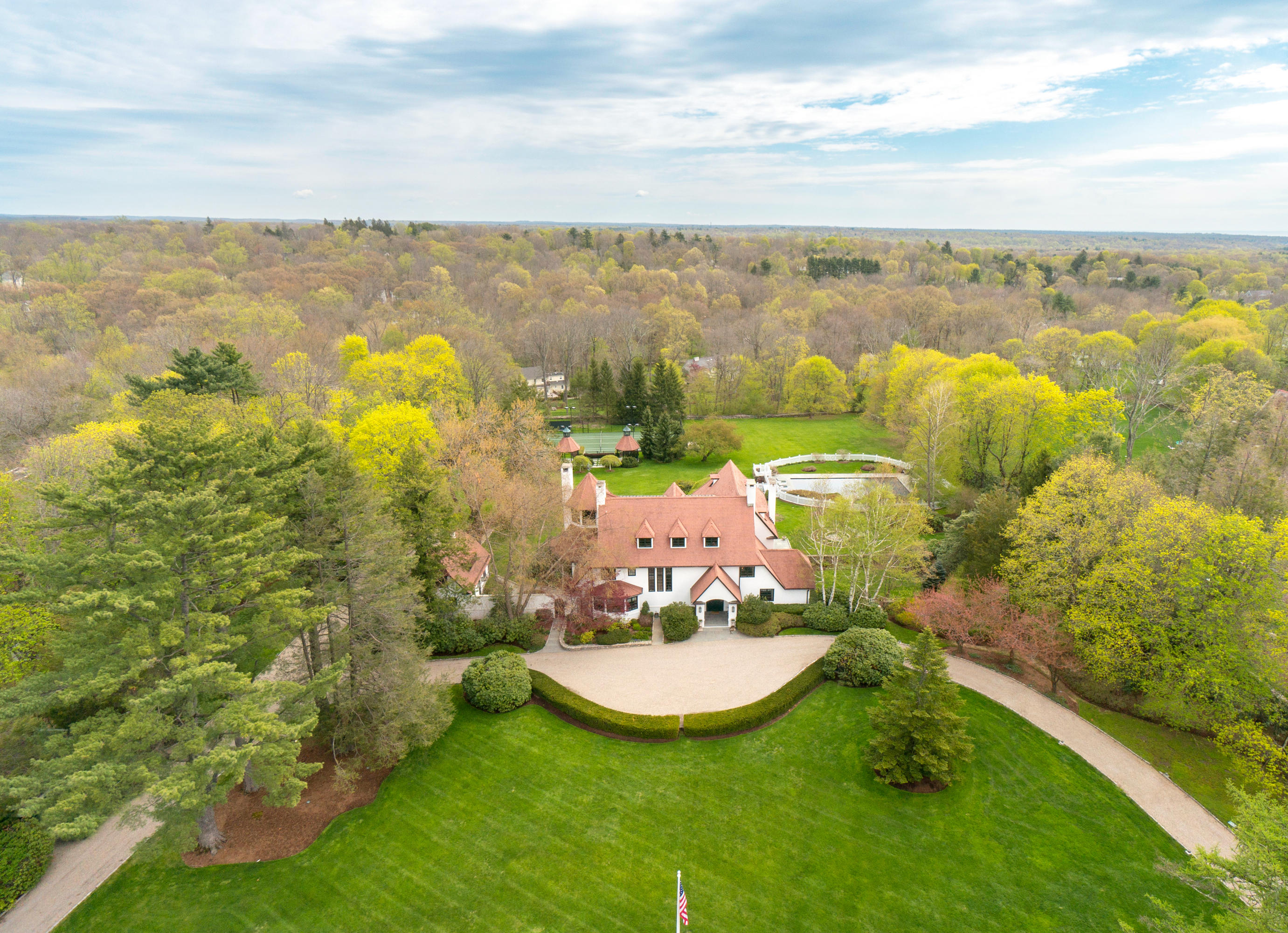 85 Rosebrook Road New Canaan, CT 06840 - Photo 1 of 27 a view of a lake with a big yard