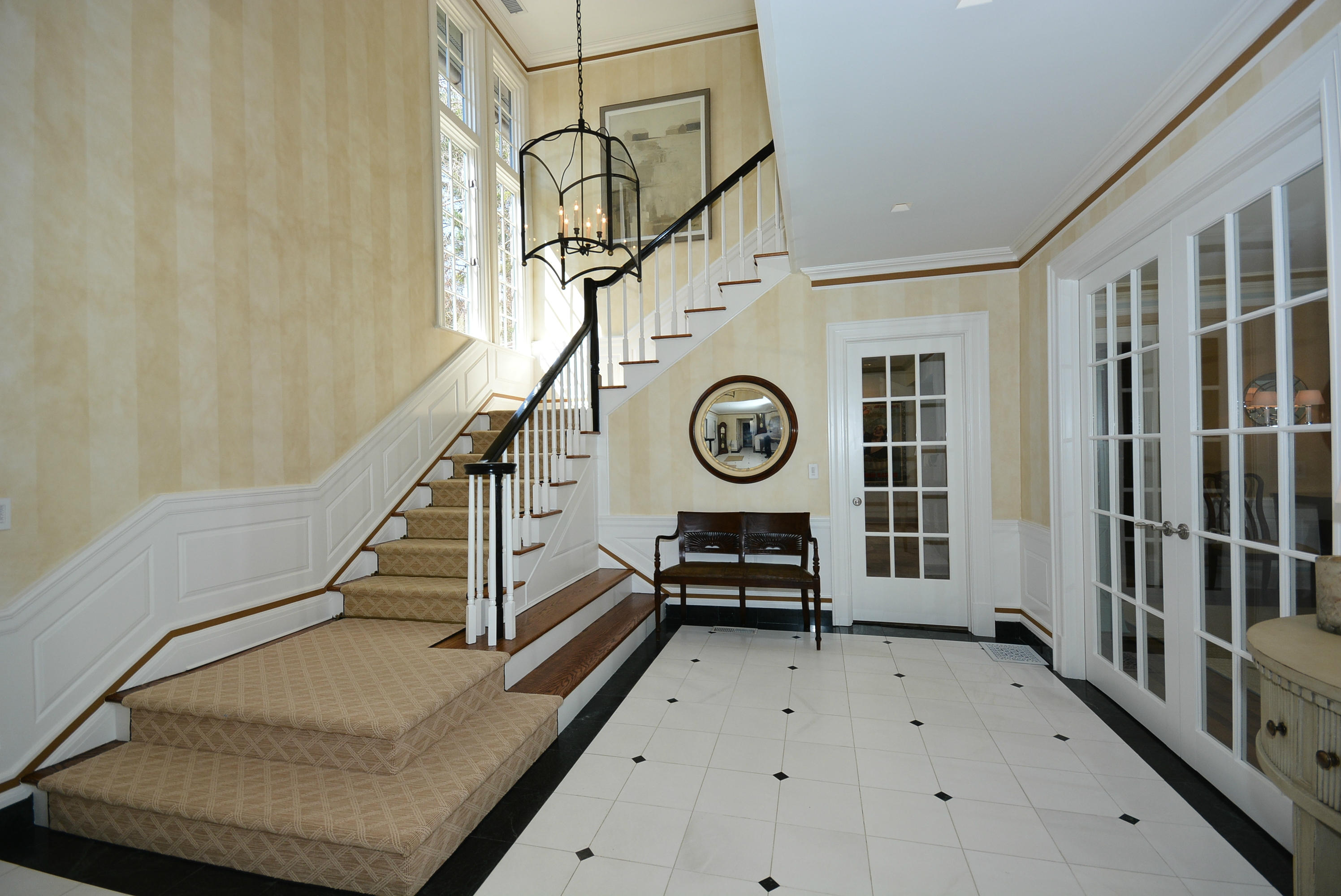 85 Rosebrook Road New Canaan, CT 06840 - Photo 3 of 27 a view of a hallway with wooden floor and staircase